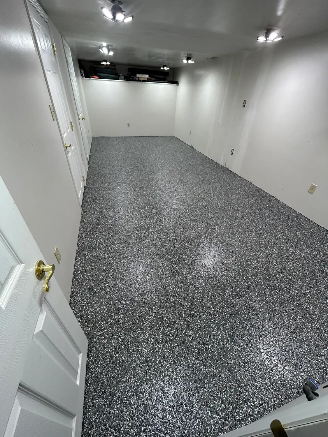 Finished basement with tan flake floor